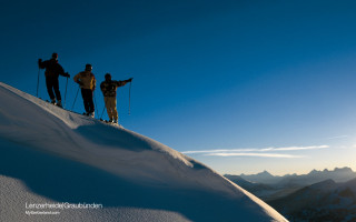 Skiers snowy mountain sunset skis - a snowy mountain top free wallpaper