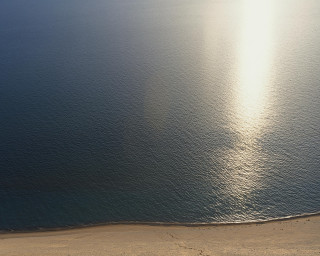 Lone boat near beach empty - zenith view free wallpaper