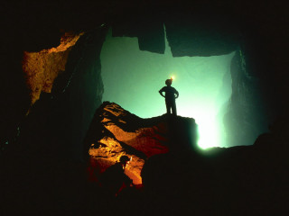 Person standing rock cave light 3 - bedwyr williams free wallpaper