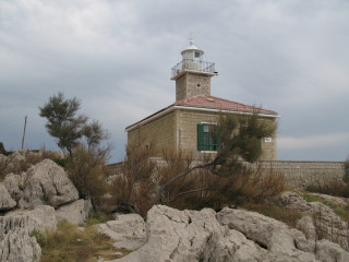 Small building light tower rocks 2 - a cloudy day free wallpaper