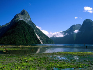 Water mountains grass people shore - ground free wallpaper