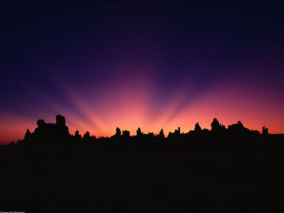 Sunset city silhouette purple sky - crepuscular ray free wallpaper