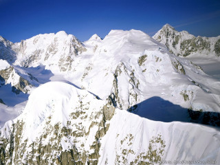 Mountain range plane window blue 4 - a view of a mountain range free wallpaper