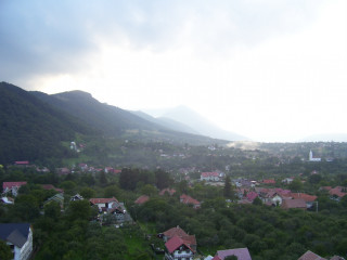 Mountain town cloudy sky forest 3 - a view of a town free wallpaper