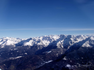 Mountain range airplane window blue 3 - a view of a mountain range free wallpaper