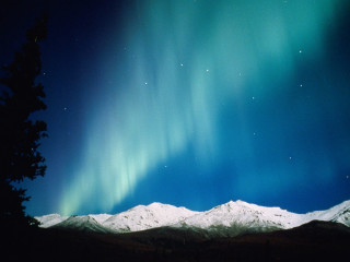 Snowy mountain green blue sky 2 - a view of a mountain free wallpaper