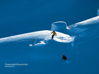 Skiing couple snow covered slope - one person free wallpaper