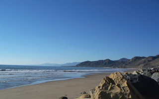 Beach rock formation ocean mountains 3 - free bikini wallpaper