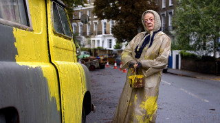 Woman raincoat yellow truck street - building free wallpaper