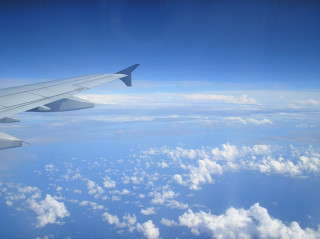 Airplane wing sky clouds water - fluxus free wallpaper