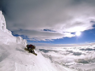 Man snowboard slope cloudy sky - a snowboard free wallpaper