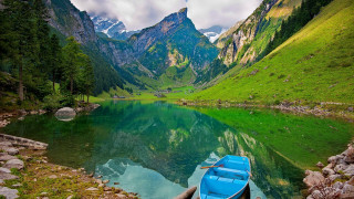 Boat docked lake mountains green - beautiful landscape free wallpaper