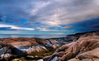 Rocky beach cloudy sky water 2 - a cloudy sky above free wallpaper