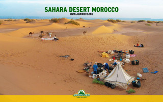 Desert group tent camel landscape - a group of people sitting free wallpaper