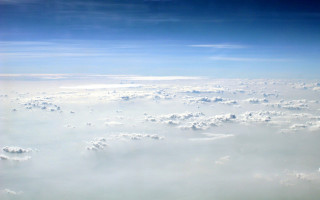 Sky clouds plane wing ocean - cloud below free wallpaper