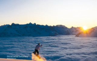 Skiing sunset mountain clouds distance 2 - below them free wallpaper