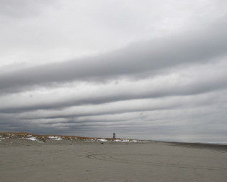 Kite beach cloudy lighthouse person 2 - widescreen free wallpaper