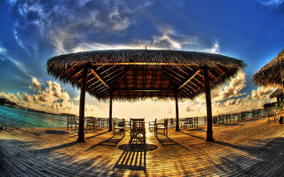 Wooden pier thatched roof benches 3 - a wooden pier free wallpaper