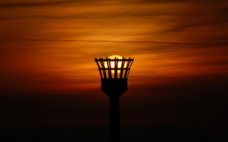 Light tower sunset ocean horizon 3 - ambient light free wallpaper