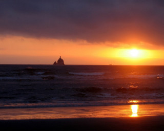 Sunset ocean lighthouse dark cloud - a lighthouse in the distance free wallpaper
