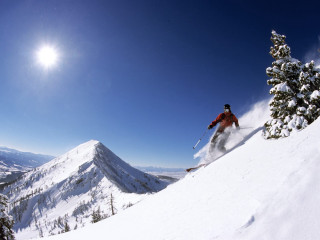 Skier skiing snowy mountain slope 4 - a snowy mountain free wallpaper