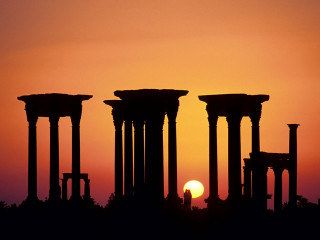 Sunset ancient ruins plane flying - a sun free wallpaper