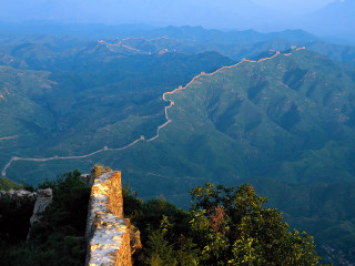 Mountain winding road forest view - a view of a mountain free wallpaper