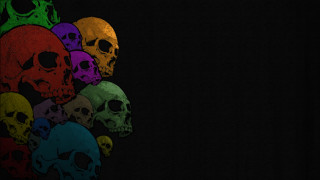 Skulls lined up black background - against a black background free wallpaper