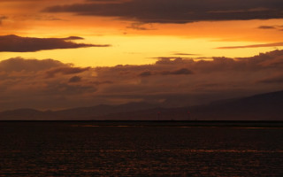 Sunset boat mountains clouds dusk - the water and mountains free wallpaper