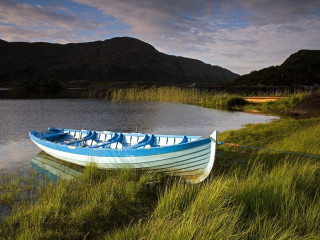Boat shore lake mountains grass - anne rigney free wallpaper