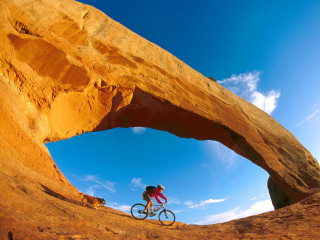 Man bike desert rock arch 3 - a man riding free wallpaper