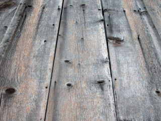 Wooden surface holes bird folk - a woodcut free wallpaper