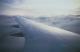 Airplane wing sky clouds sunbeam 2 - cloud below free wallpaper
