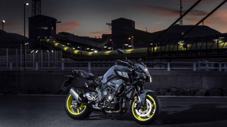 Motorcycle parked night bridge background - a jigsaw puzzle free wallpaper for desktop