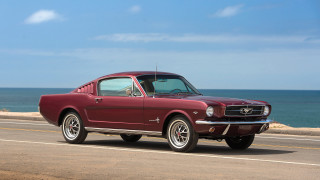Red mustang car driving ocean - a blue sky free wallpaper