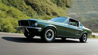 Green mustang driving road forest - hillside free wallpaper