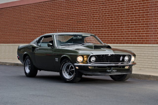 Green muscle car brick wall - a brick wall behind free wallpaper