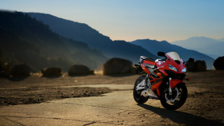 Red motorcycle dirt road mountains - a red motorcycle free wallpaper