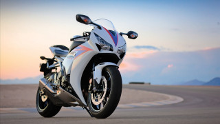 Motorcycle parked road mountain range 5 - sunset free wallpaper