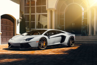 White sports car parked building 2 - a white sports car free wallpaper