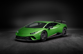Green sports car dark room 2 - a green sports car free wallpaper