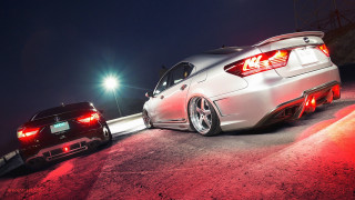 Two cars parked night lights - the car free wallpaper