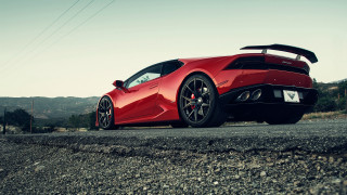 Red sports car road sky 5 - a sky background and a mountain range in the distance free wallpaper