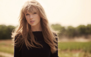 Woman long hair field grass 4 - a black sweater free wallpaper