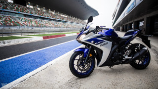 Motorcycle parked track stadium blue - a stadium free wallpaper