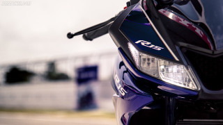 Motorcycle closeup parked street sky - a sky background and a building in the background free wallpaper