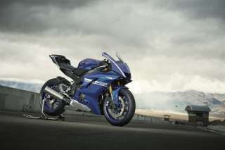 Blue motorcycle cloudy sky mountains - a blue motorcycle free wallpaper