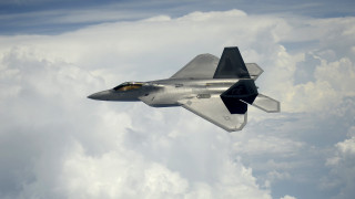 Fighter jet flying cloudy sky - a cloudy sky above the clouds free wallpaper