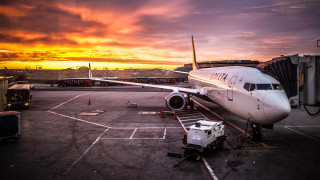 Plane parked tarmac airport sunset 3 - sunset free wallpaper