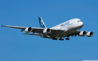 Jetliner flying blue sky landing 3 - the wing free wallpaper